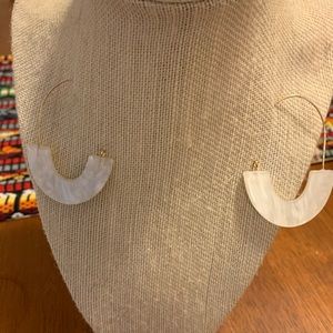 White hoop fashion earrings.